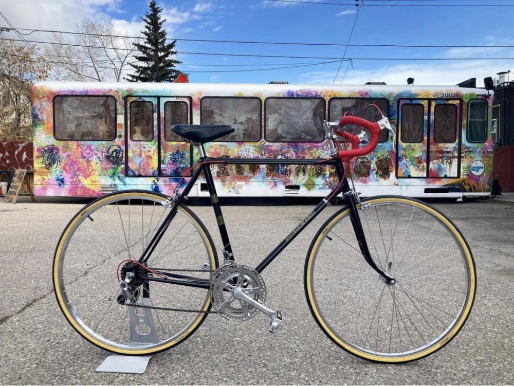 A photo of a bike infront of a CTrain